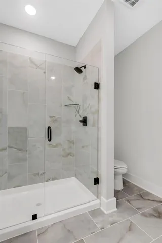 a bathroom with a bathtub and a toilet