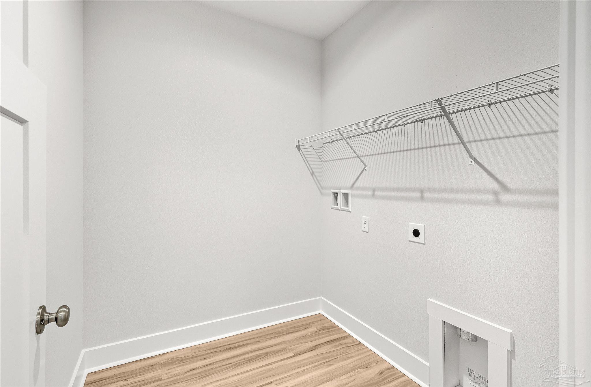 4733 Redhead Court Pace, FL 32571 - Photo 16 of 48 a view of a room with racks on the wall