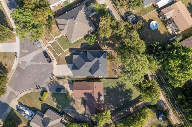 an aerial view of residential house with outdoor space and swimming pool