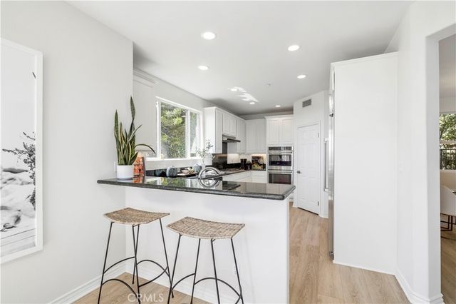 a view of a walk in closet with empty racks