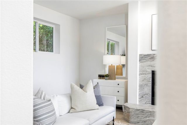 a view of kitchen with wooden floor and electronic appliances