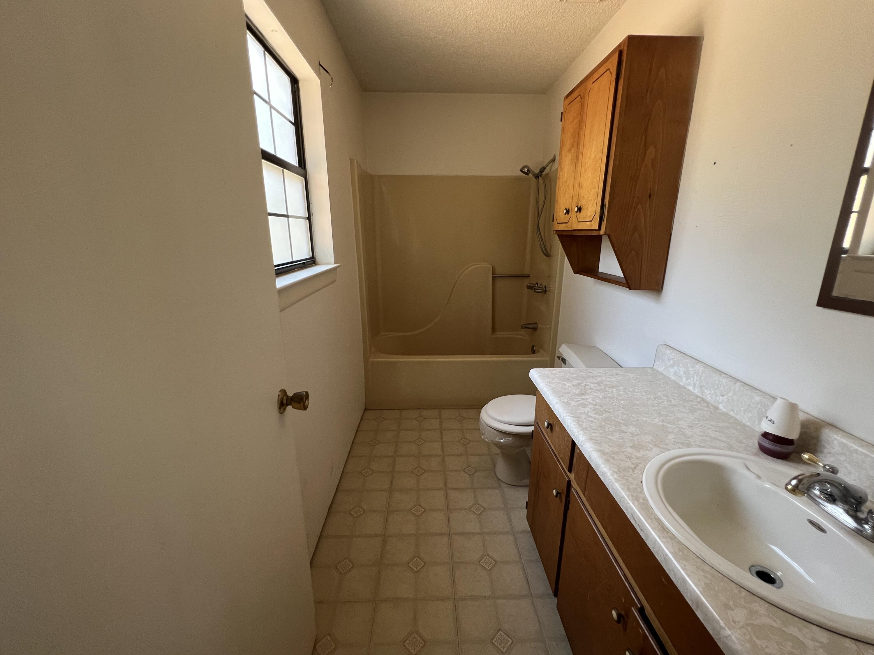 5256 Lassiter Road Milton, FL 32571 - Photo 11 of 20 a bathroom with a sink and a mirror