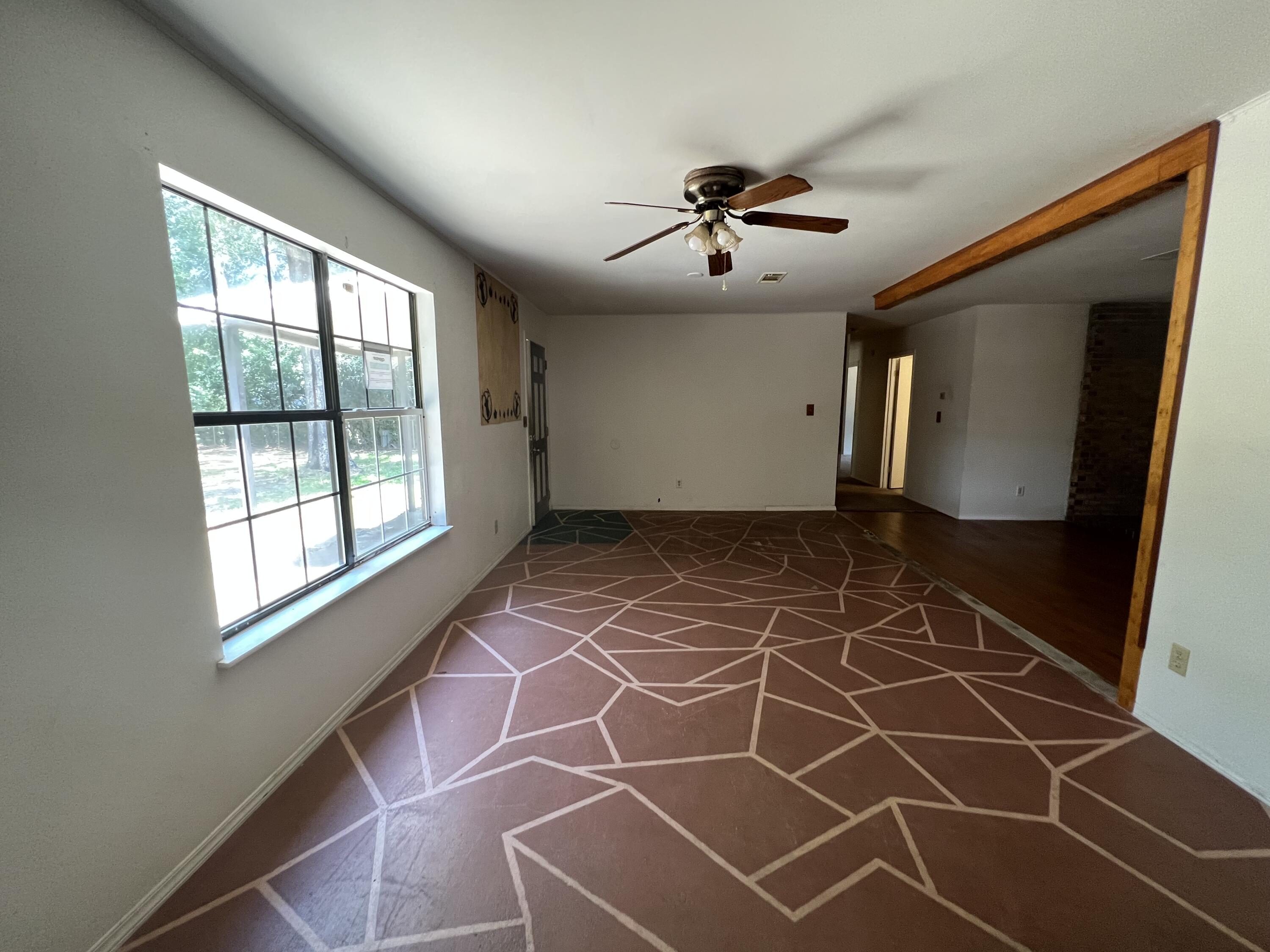 5256 Lassiter Road Milton, FL 32571 - Photo 13 of 20 a view of an empty room with a window