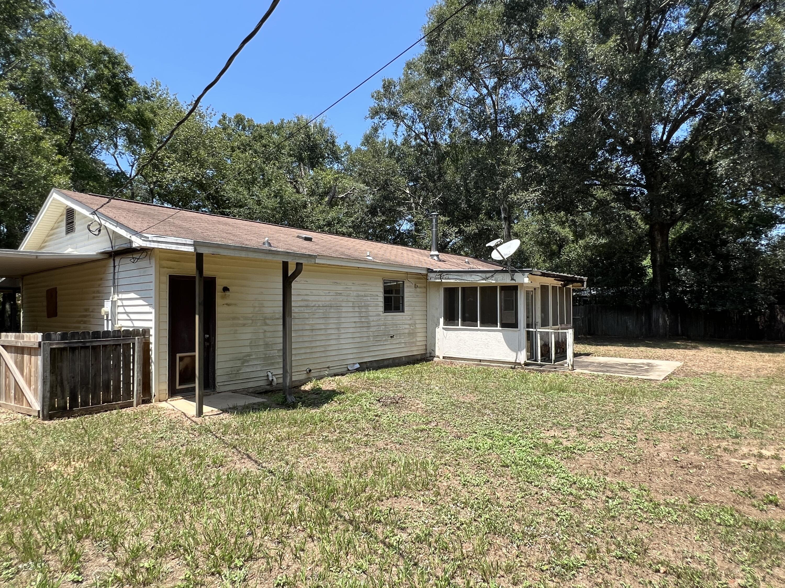 5256 Lassiter Road Milton, FL 32571 - Photo 18 of 20 a view of a house with a yard