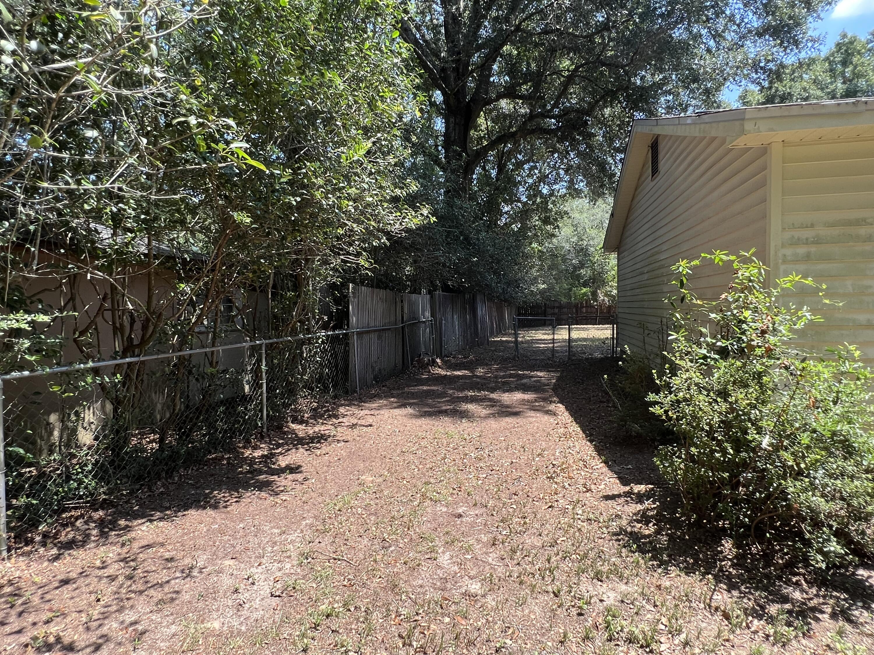 5256 Lassiter Road Milton, FL 32571 - Photo 20 of 20 a backyard of a house with lots of green space