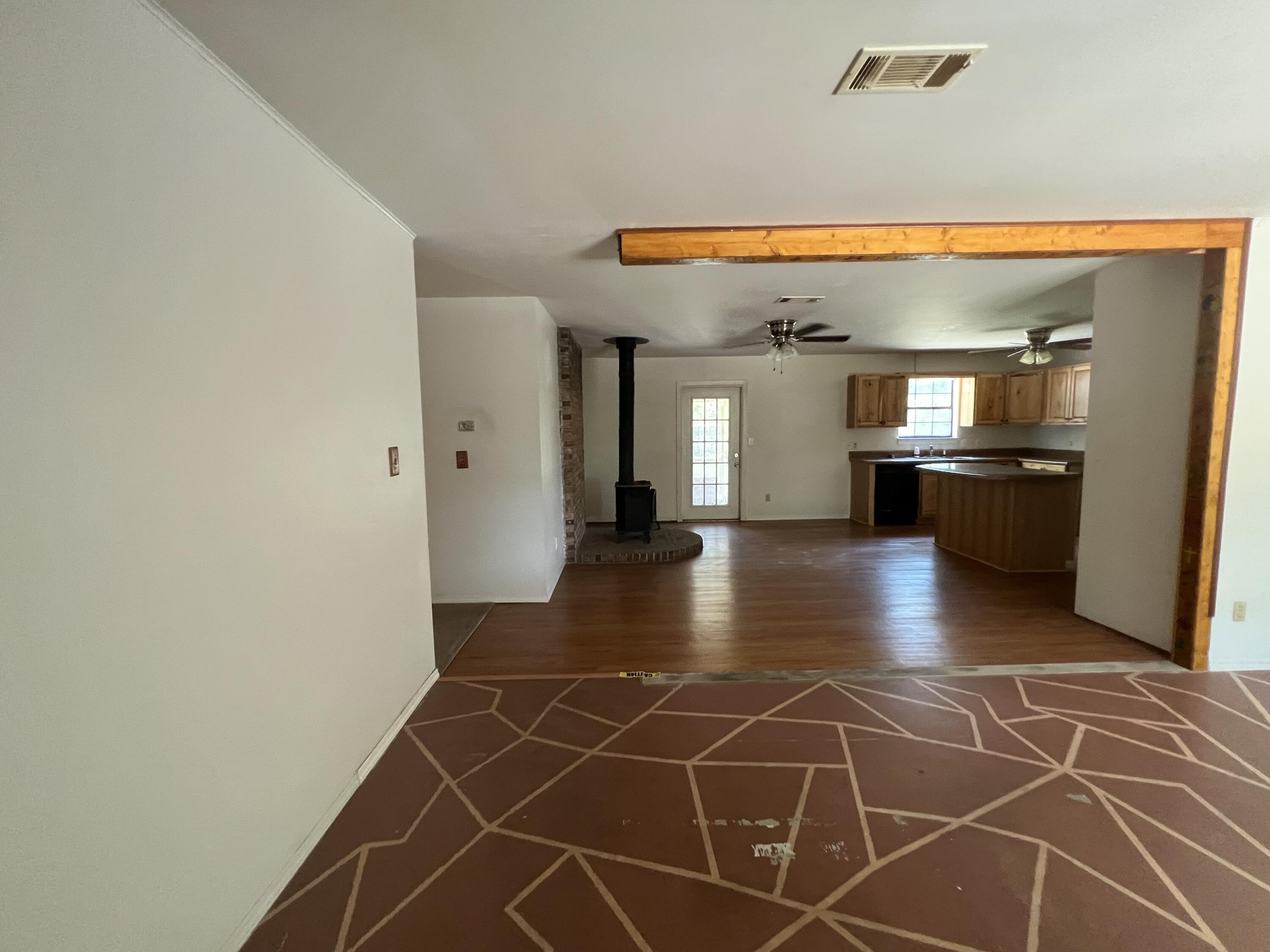 5256 Lassiter Road Milton, FL 32571 - Photo 2 of 20 a view of a livingroom with furniture and an empty room
