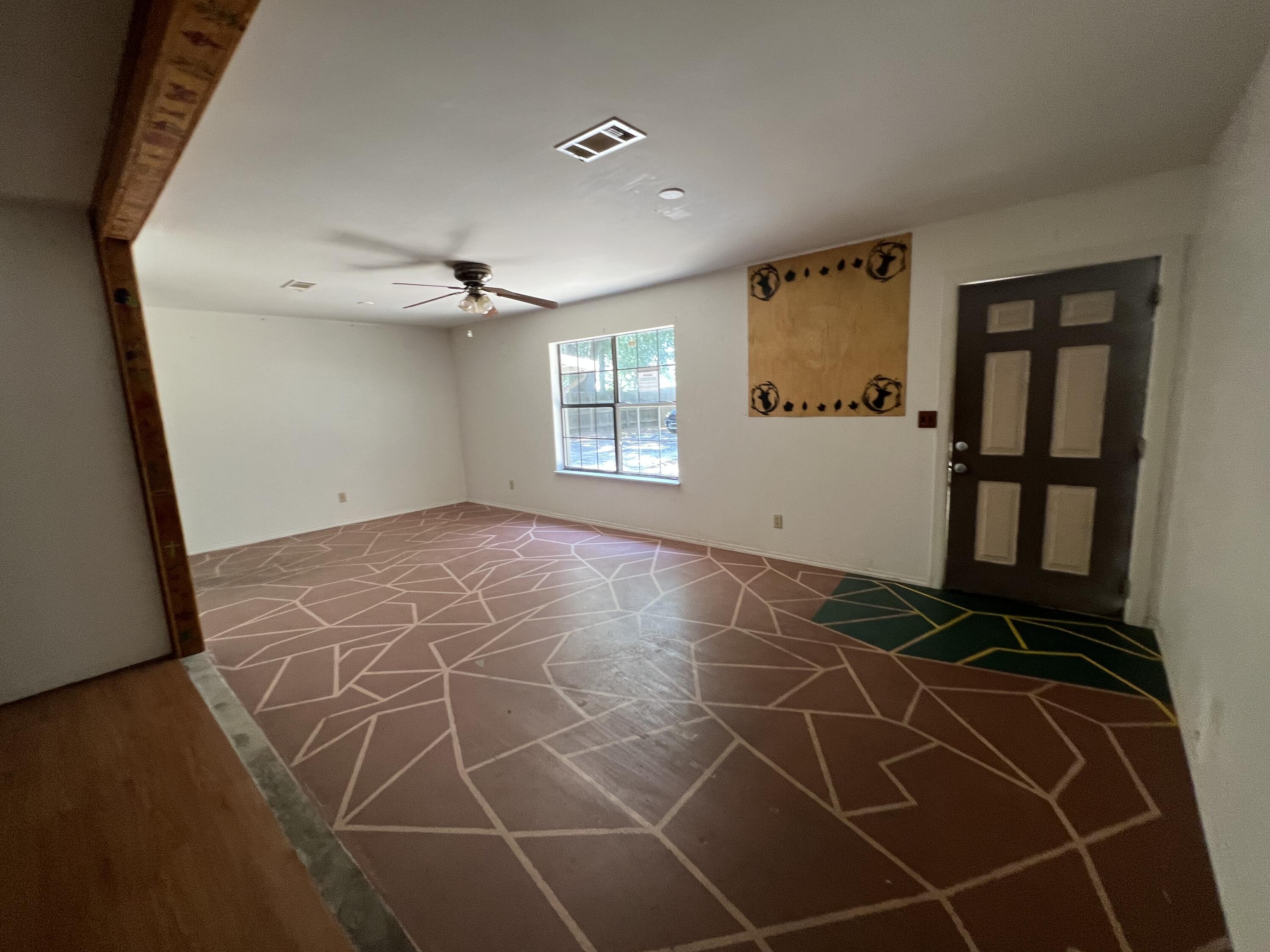 5256 Lassiter Road Milton, FL 32571 - Photo 5 of 20 a view of an empty room with a window