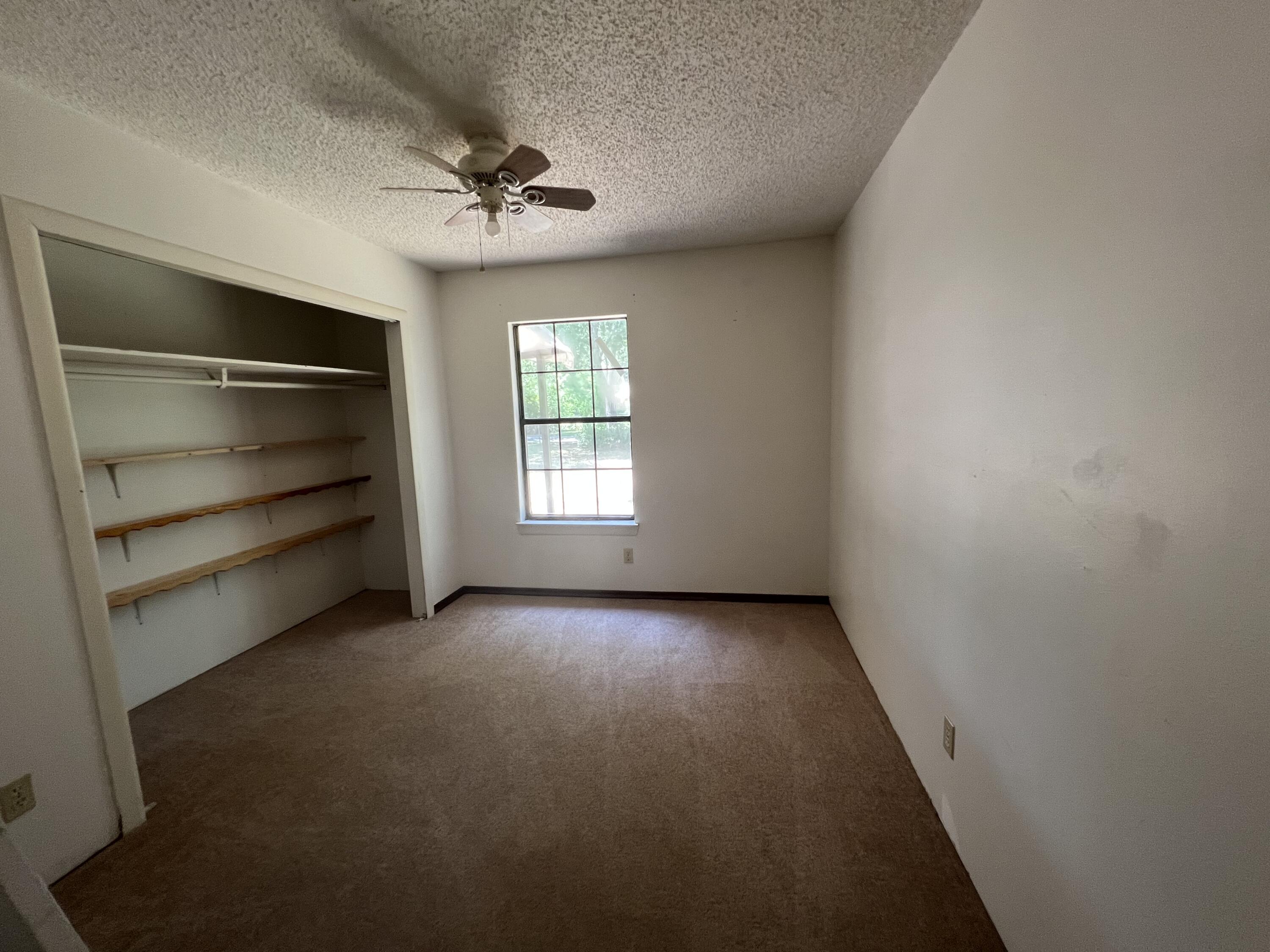 5256 Lassiter Road Milton, FL 32571 - Photo 8 of 20 a view of an empty room with a window