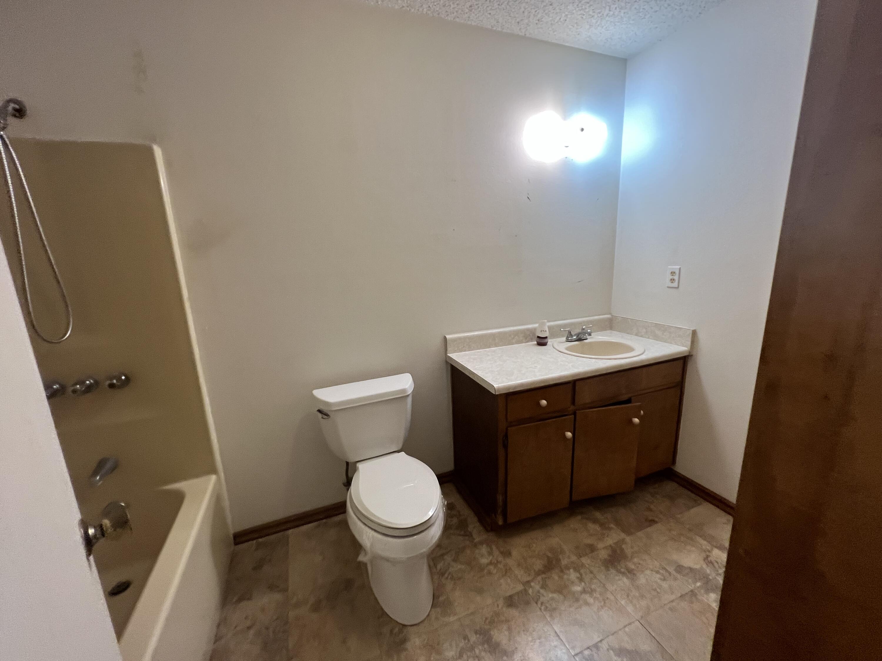 5256 Lassiter Road Milton, FL 32571 - Photo 9 of 20 a spacious bathroom with a toilet sink and mirror