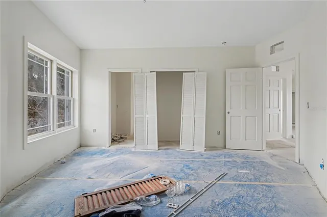 an empty room with windows