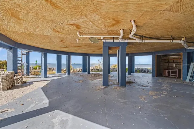 a view of a hall with wooden floor