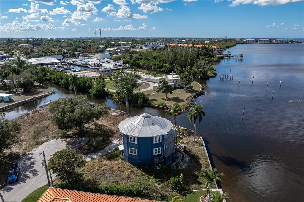321 Bayridge Place Punta Gorda, FL 33950 - Photo 48 of 50 a view of a house with a yard and lake view