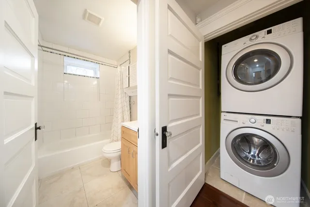 a view of a bathroom with a washer and dryer