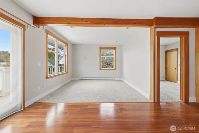 a view of livingroom with hardwood floor and hallway