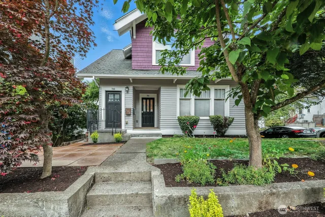 front view of a house with a yard