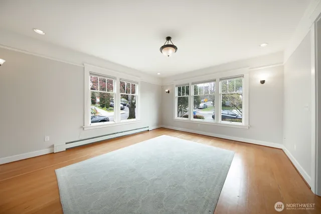 an empty room with windows and entrance