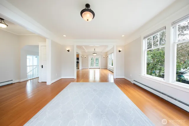 a spacious bedroom with a large bed and a large window