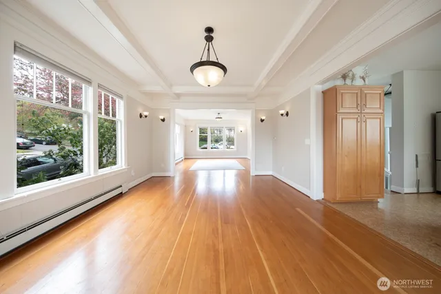 a view of an entryway with wooden floor