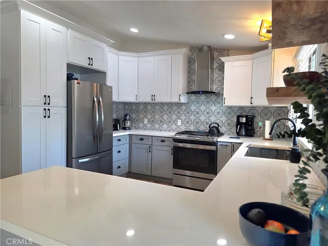 a bedroom with a bed and a lamp on dresser