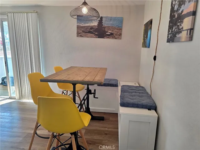 a bedroom with a bed and a flat tv screen on dresser
