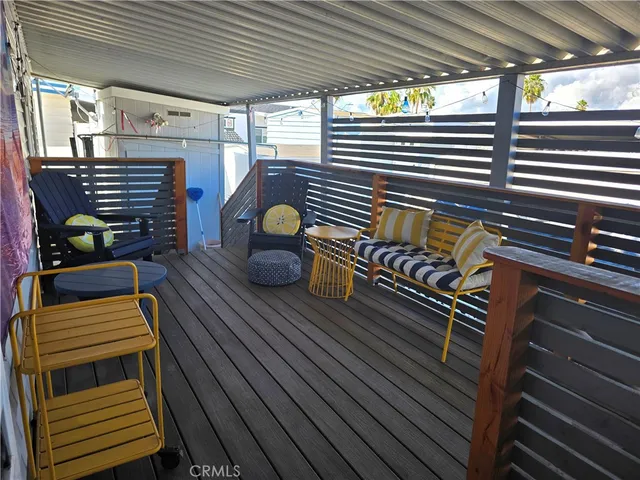 a living room with furniture and a garden