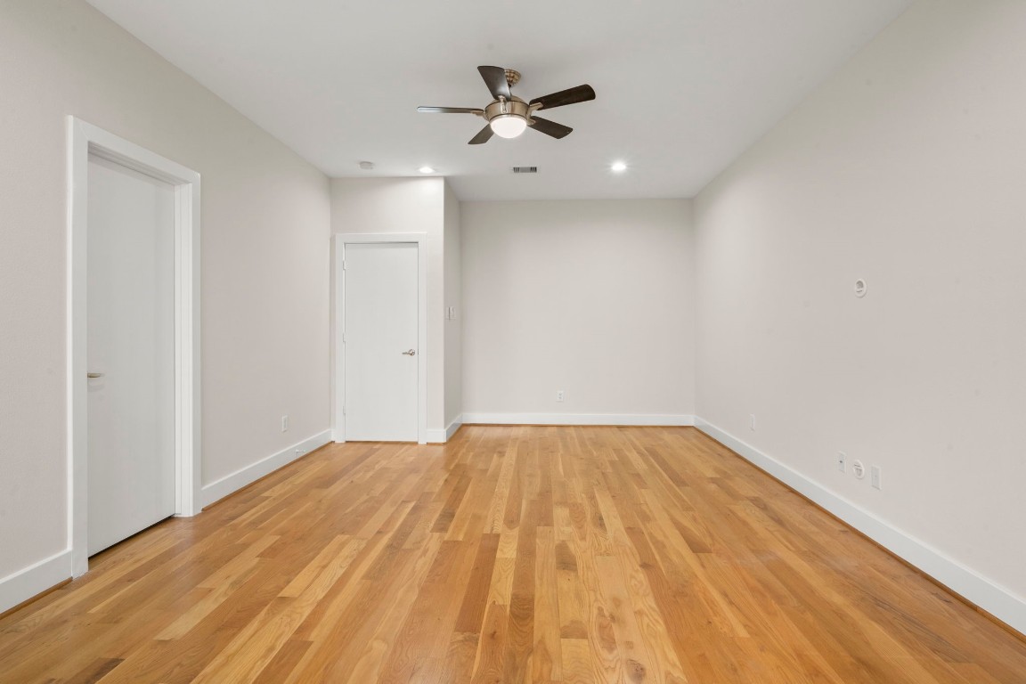 5527 Darling Street, Unit A Houston, TX 77007 - Photo 19 of 31 wooden floor in an empty room