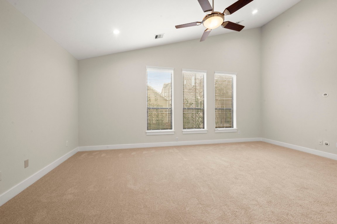 5527 Darling Street, Unit A Houston, TX 77007 - Photo 24 of 31 an empty room with windows and fan
