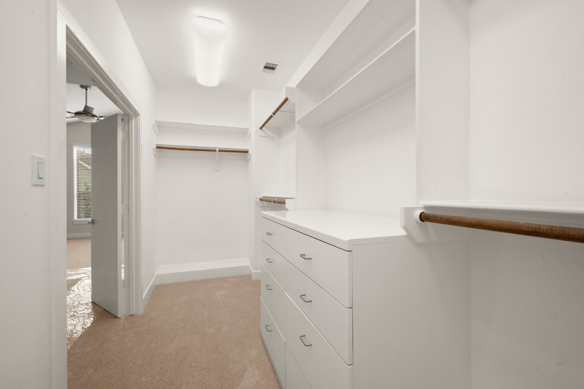 5527 Darling Street, Unit A Houston, TX 77007 - Photo 28 of 31 a kitchen with white cabinets and white appliances