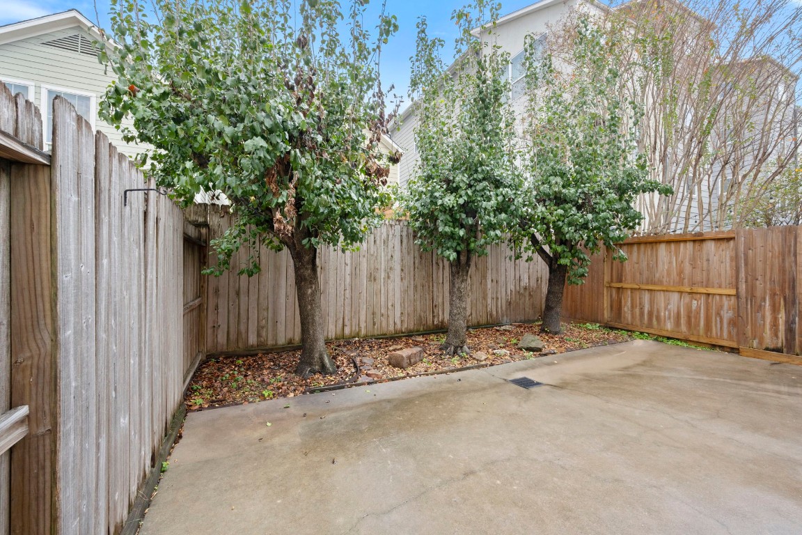 5527 Darling Street, Unit A Houston, TX 77007 - Photo 29 of 31 a wooden fence with trees in front of it