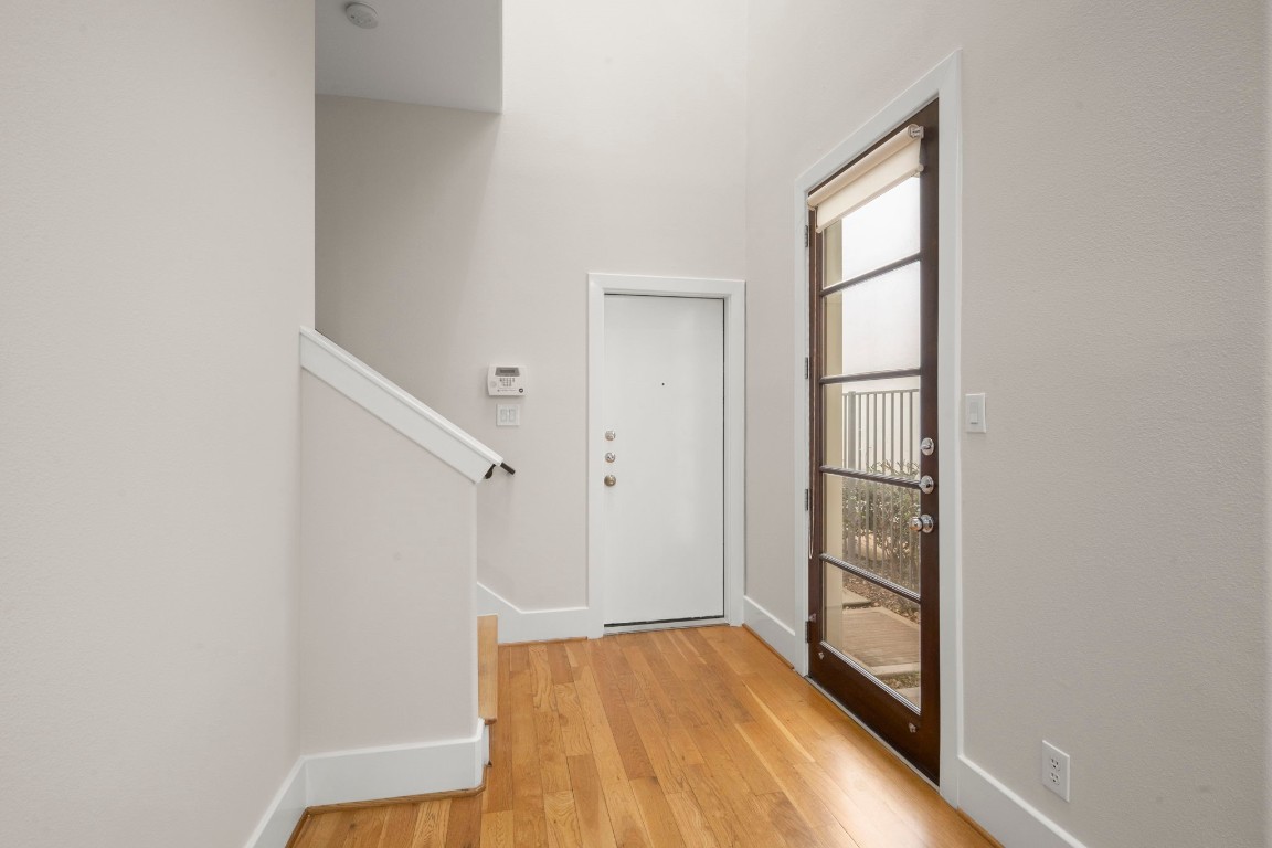 5527 Darling Street, Unit A Houston, TX 77007 - Photo 7 of 31 a view of a room with wooden floor and staircase