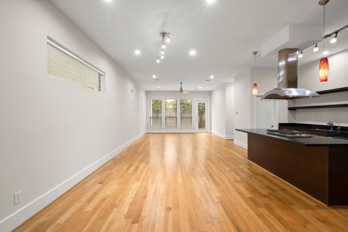 5527 Darling Street, Unit A Houston, TX 77007 - Photo 8 of 31 a large kitchen with stainless steel appliances granite countertop a stove and a large window