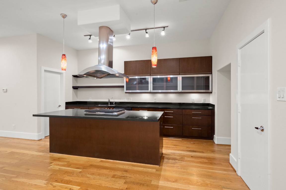 5527 Darling Street, Unit A Houston, TX 77007 - Photo 9 of 31 a kitchen with stainless steel appliances granite countertop a stove and a refrigerator