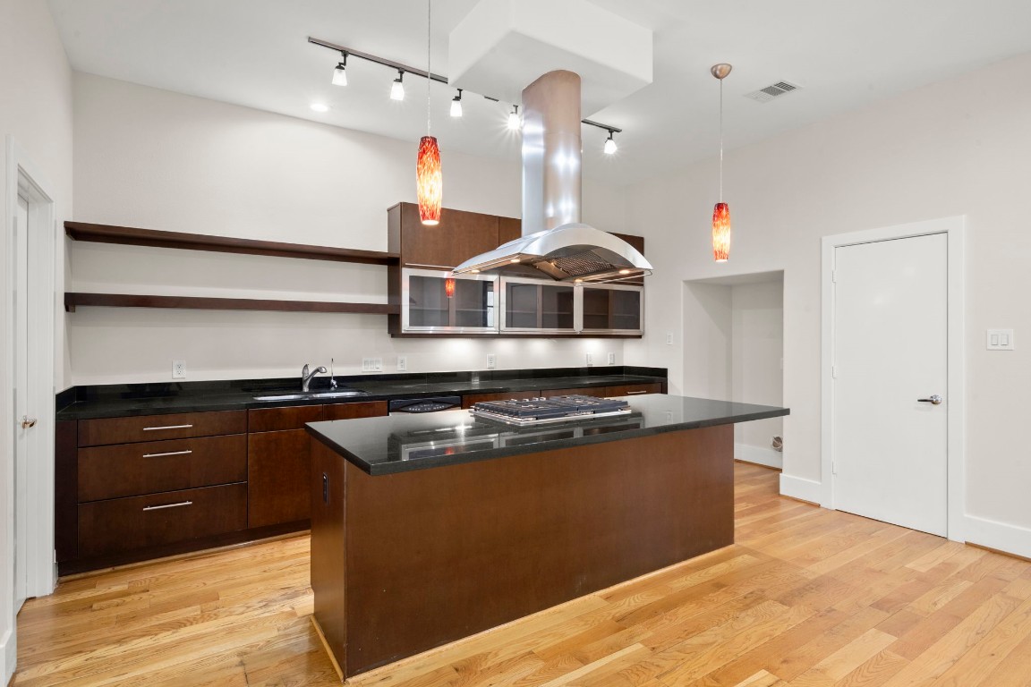 5527 Darling Street, Unit A Houston, TX 77007 - Photo 10 of 31 a kitchen with stainless steel appliances granite countertop a sink a stove and a refrigerator