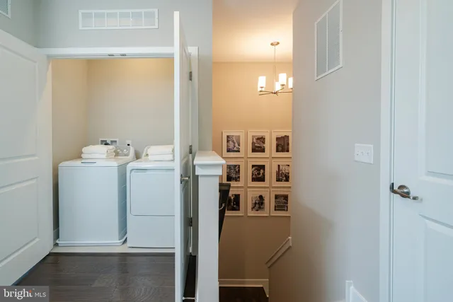 a front view of a building with a garden