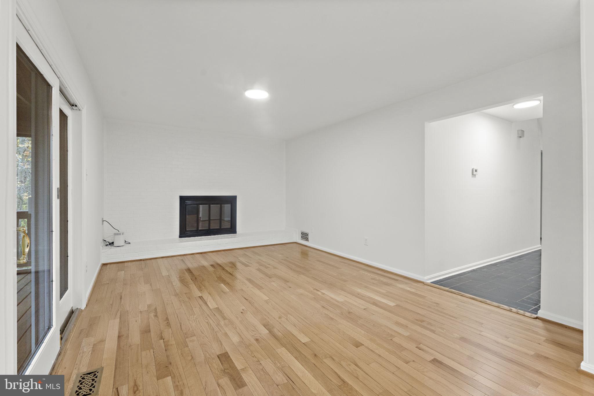 12574 Quincy Adams Court Herndon, VA 20171 - Photo 11 of 67 a view of an empty room and wooden floor