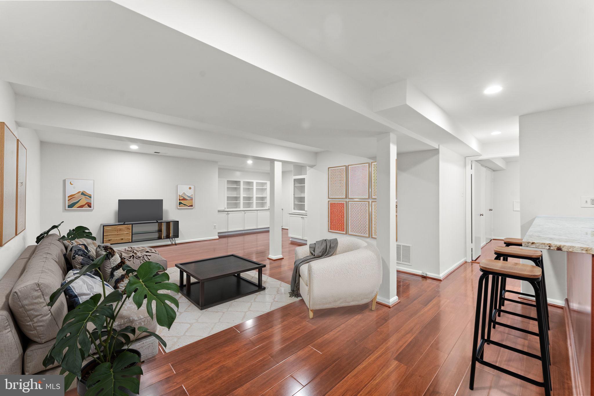 12574 Quincy Adams Court Herndon, VA 20171 - Photo 40 of 67 a living room with furniture and wooden floor