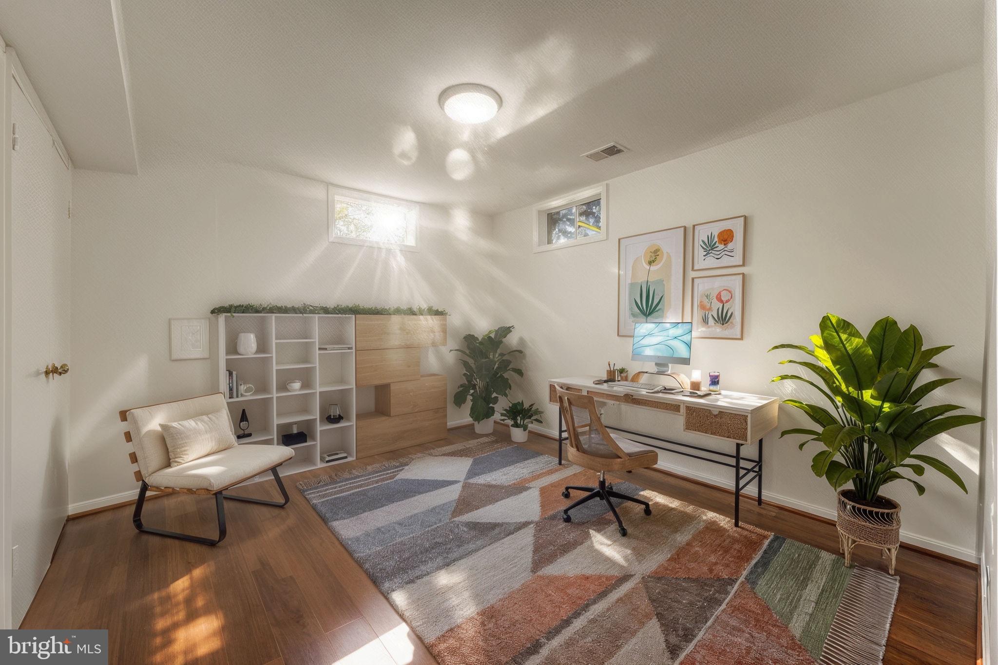 12574 Quincy Adams Court Herndon, VA 20171 - Photo 45 of 67 a living room with furniture a chandelier and a potted plant