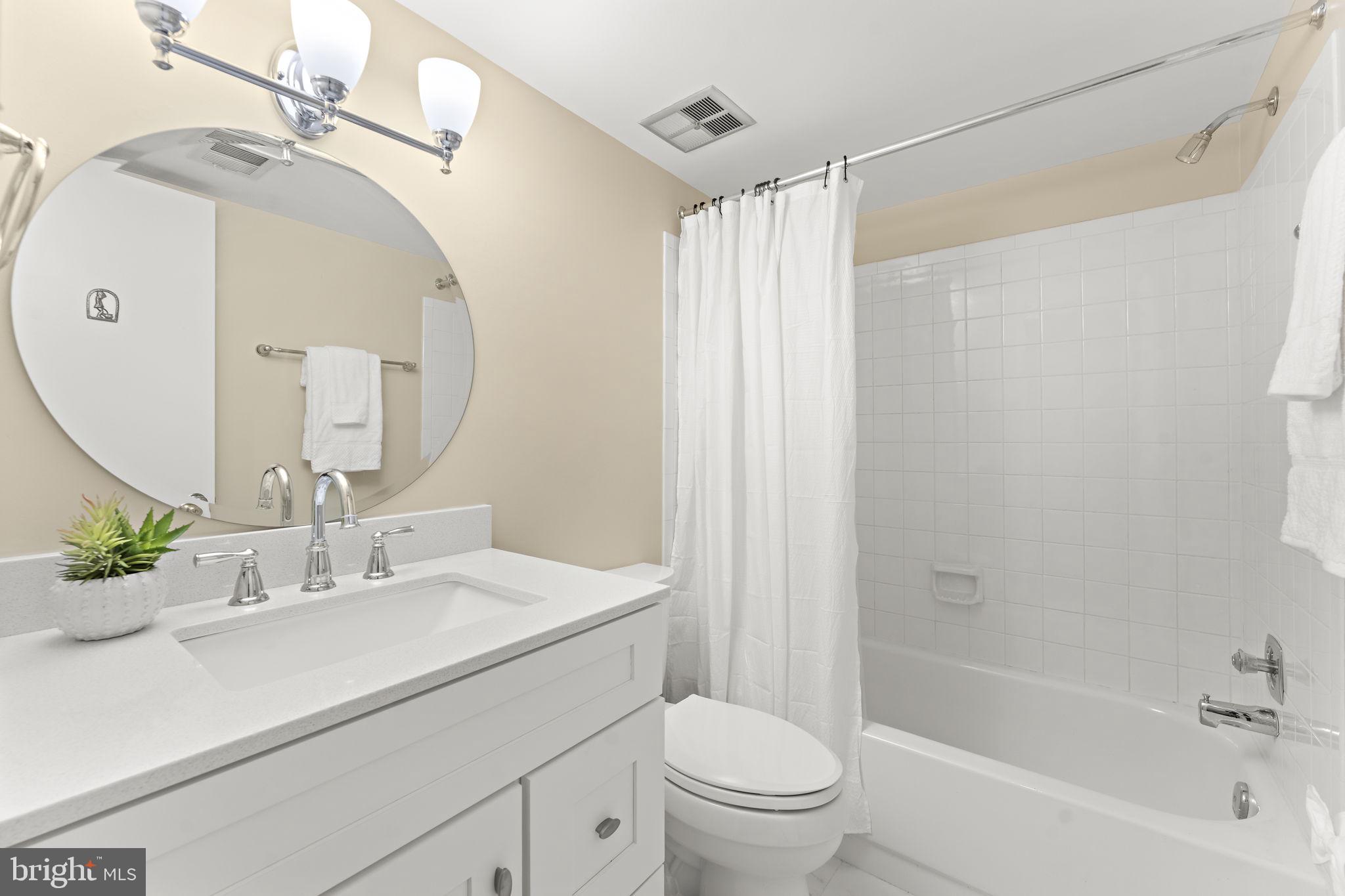 12574 Quincy Adams Court Herndon, VA 20171 - Photo 46 of 67 a bathroom with a sink toilet and shower