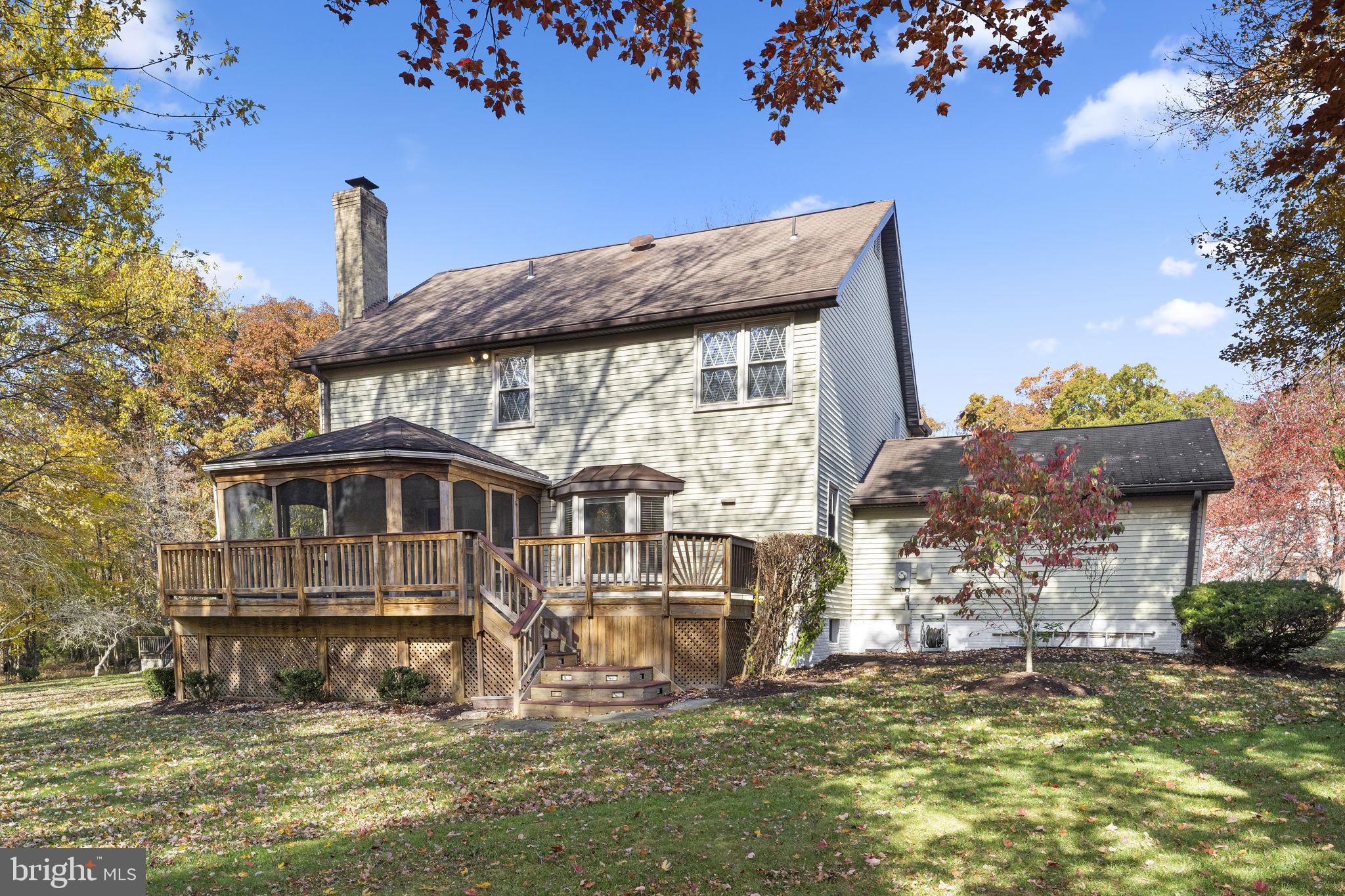 12574 Quincy Adams Court Herndon, VA 20171 - Photo 54 of 67 a front view of a house with a yard