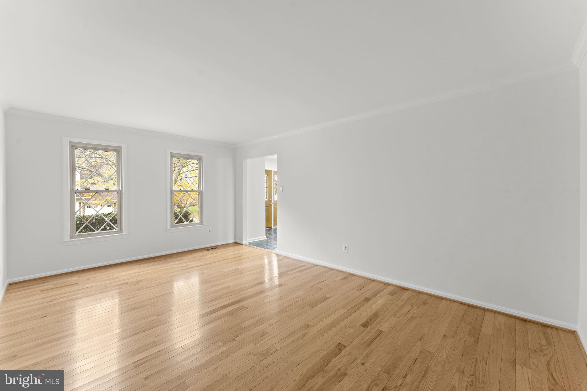 12574 Quincy Adams Court Herndon, VA 20171 - Photo 6 of 67 wooden floor in an empty room with a window