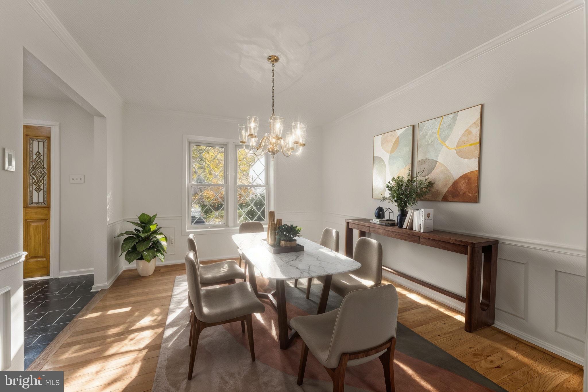12574 Quincy Adams Court Herndon, VA 20171 - Photo 7 of 67 a view of a dining room with furniture a chandelier and wooden floor