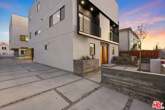 a view of a house with a street