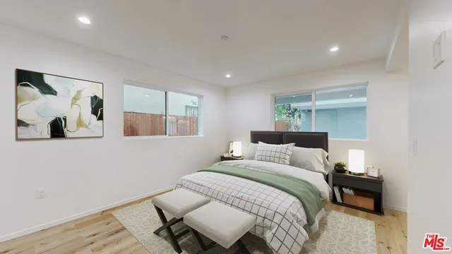 a bedroom with a bed and lamp