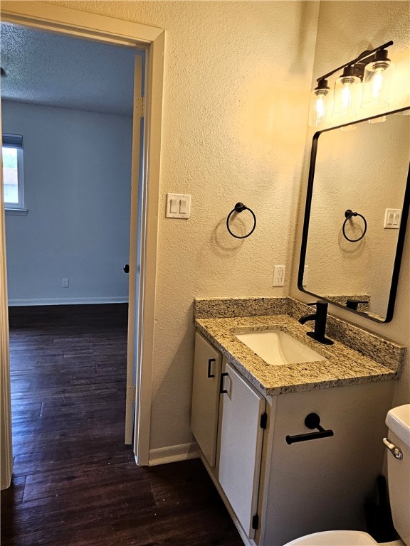 4816 Delwood Street, Unit 4 Corpus Christi, TX 78413 - Photo 16 of 22 a bathroom with a granite countertop sink and a mirror