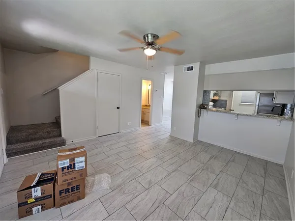 a view of a kitchen with a sink
