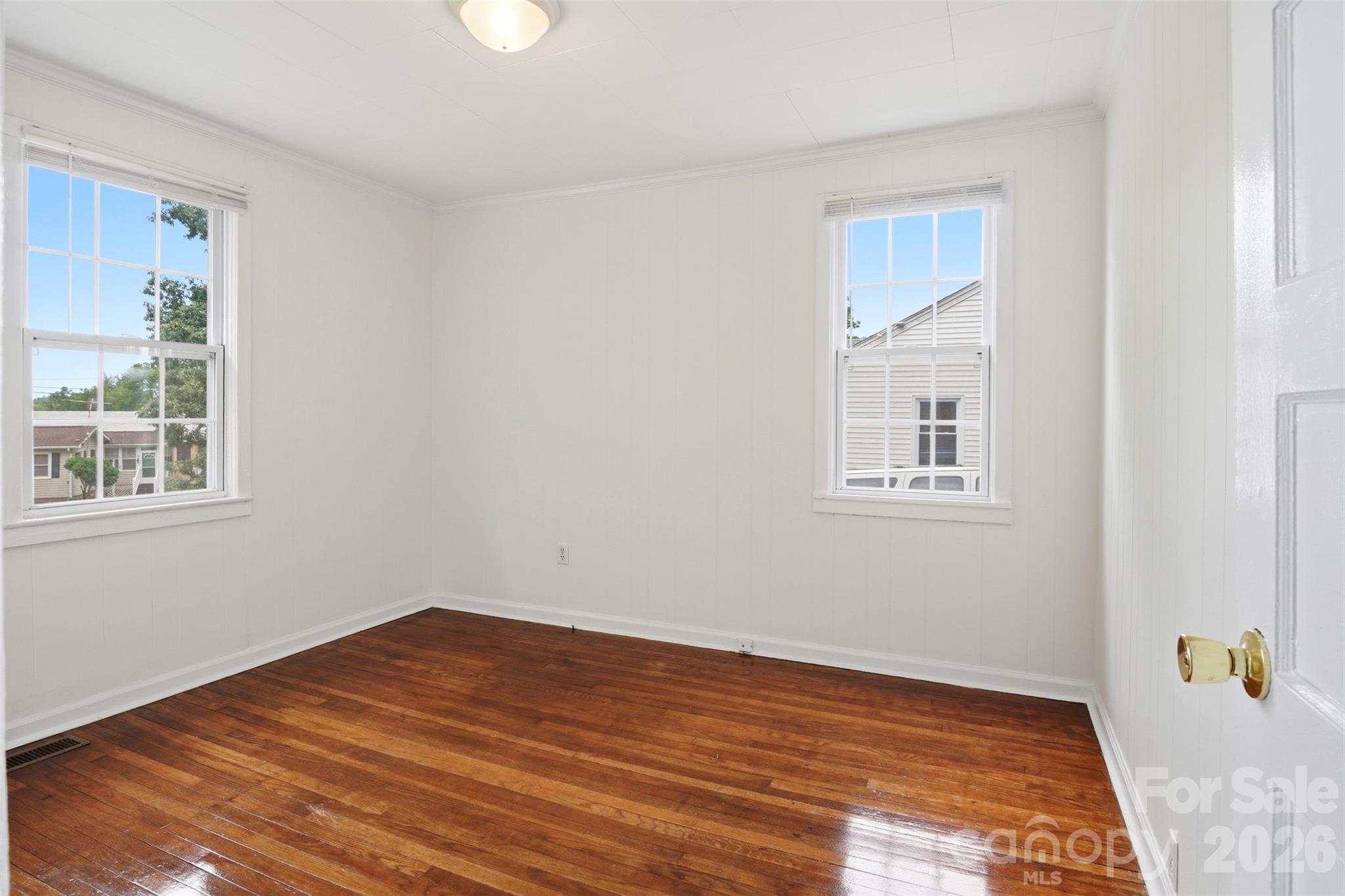 128 Ella Street Chester, SC 29706 - Photo 17 of 18 a view of empty room with wooden floor and fan