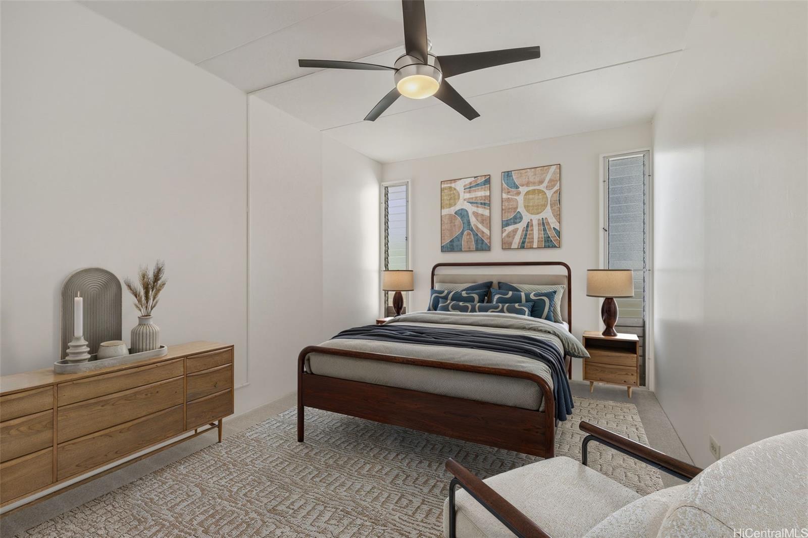 910 Ahana Street, Unit 308 Honolulu, HI 96814 - Photo 14 of 20 a bedroom with a bed and a dresser