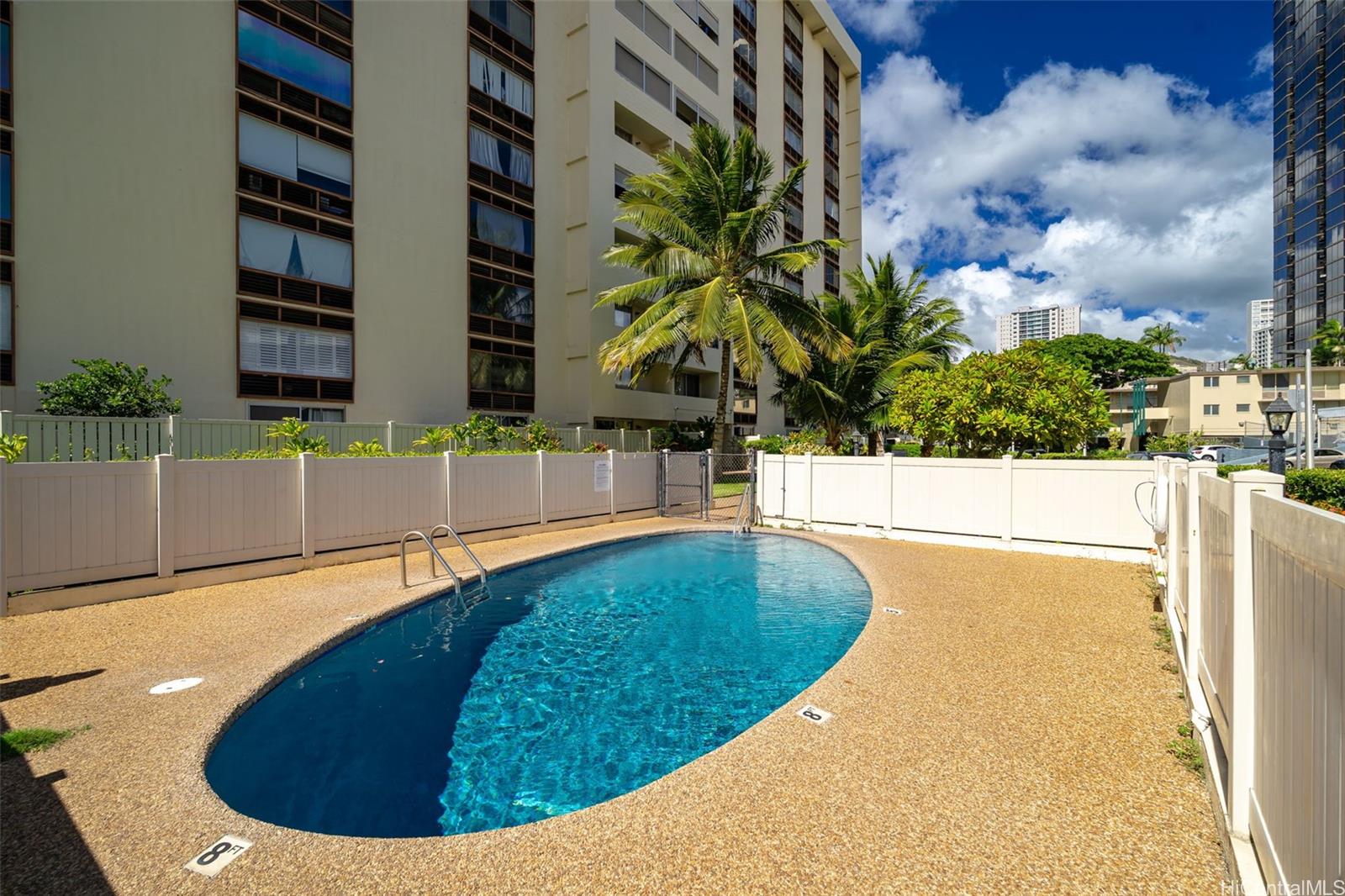 910 Ahana Street, Unit 308 Honolulu, HI 96814 - Photo 16 of 20 a view of a swimming pool with a sitting space
