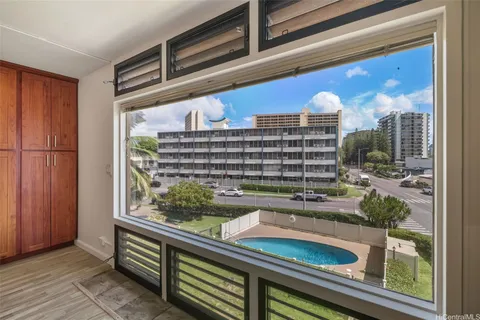 a kitchen with a sink and a large window