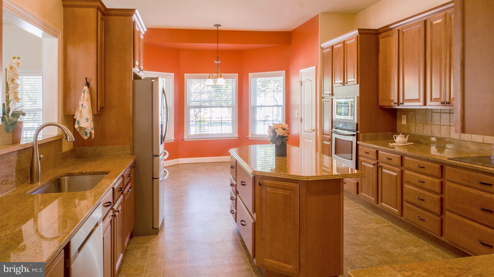 824 Andover Road Linthicum, MD 21090 - Photo 3 of 29 a kitchen with stainless steel appliances a sink and cabinets